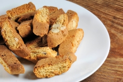 White plate piled with lots of Tuscan biscotti cookies